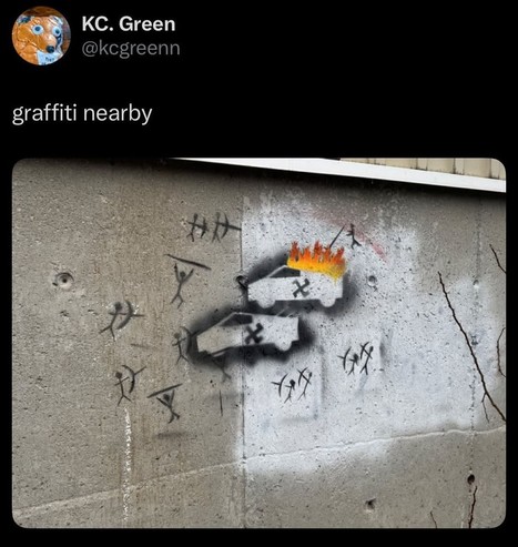 Graffiti resembling a mural:
Stick-figure huntsmen with spears and bows hunt two cybertrucks with swasticas on them. One truck is burning