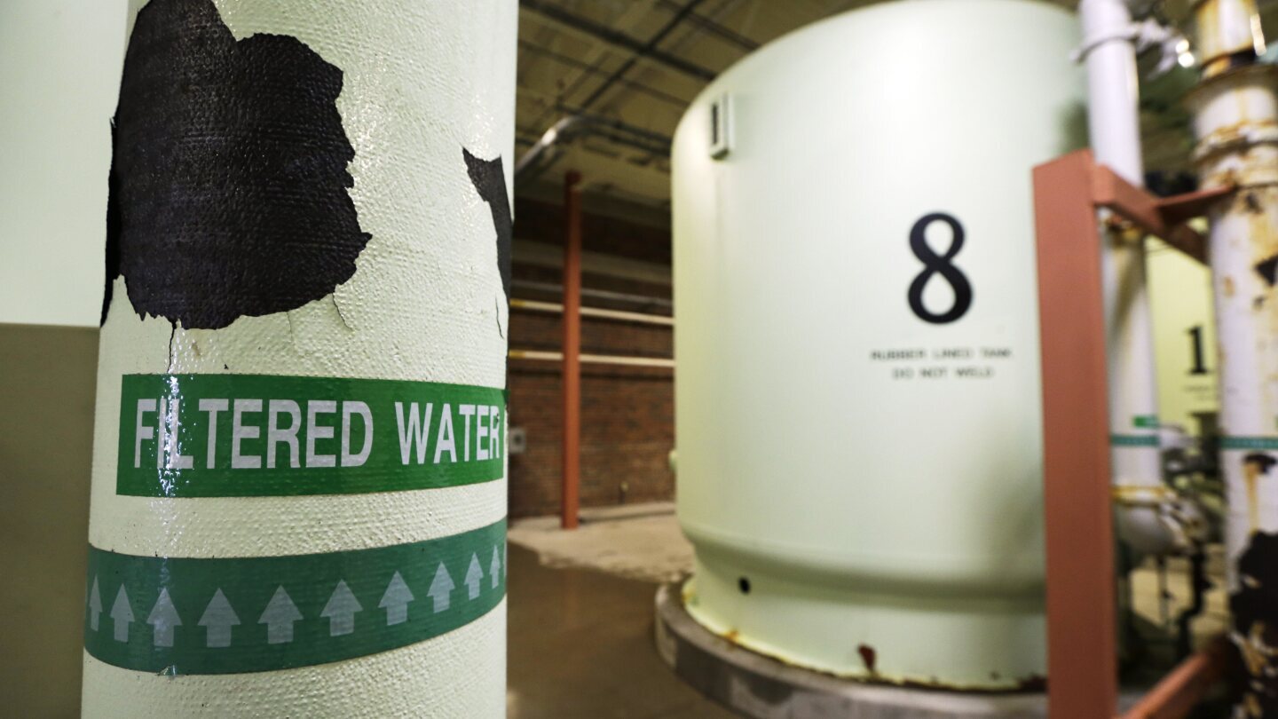 A sign is seen on a pipe in the Nitrate Removal Facility at the Des Moines Water Works treatment plant, May 16, 2013, in Des Moines, Iowa. (AP Photo/Charlie Neibergall, File)