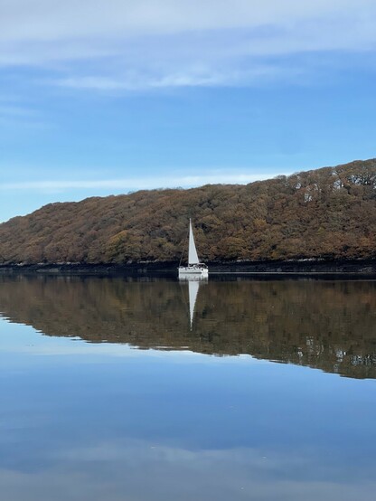 A yacht sailing on calm water