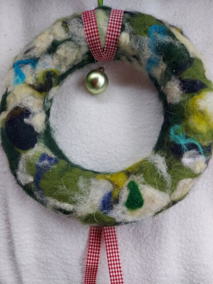 Needle felted wreath with green bauble