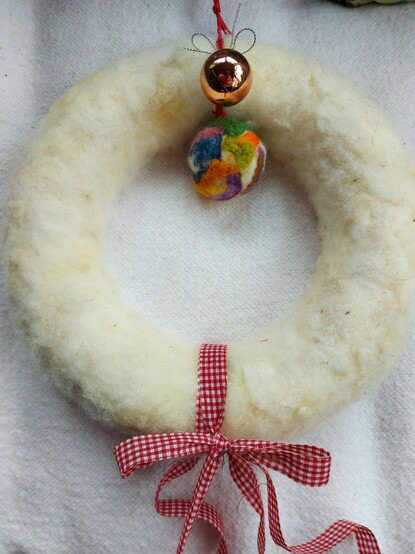 White needle felted wreath with 2 baubles