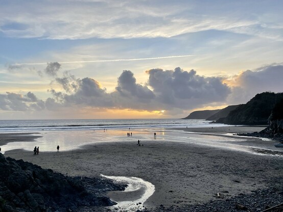 Caswell beach near sunset, with some clouds and blue sky 