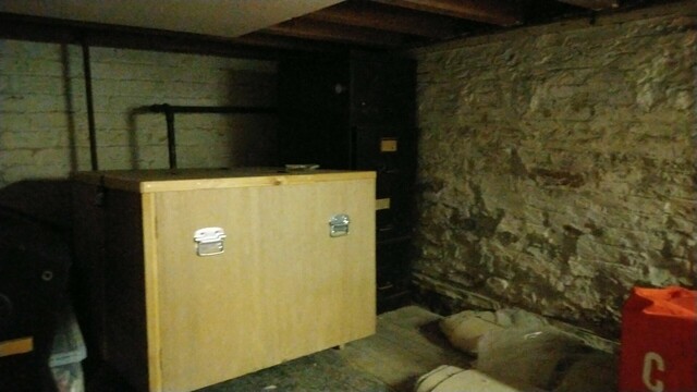 Under the stage at the Dinas Powys parish Hall, filing cabinets and old brickwork
