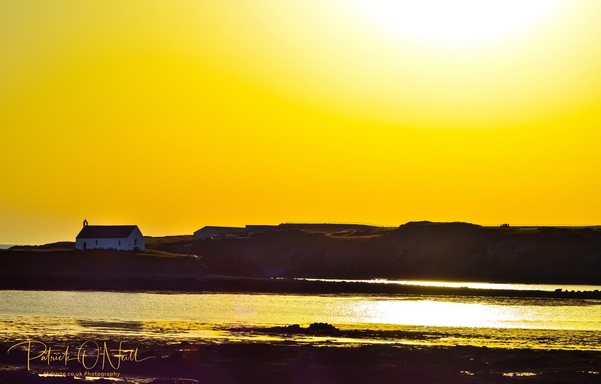 Eglwys Cwyfan in the summer evening sky. Near Anglesey Race Circuit, Anglesey - Wales