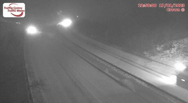 Traffic camera showing snow on the A55 at Rhuallt Hill.
