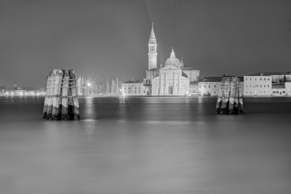A calm and peaceful black and white, fine art shout of a canal in Venice - Canale della Giudecca