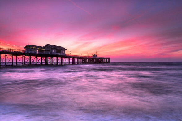 Penarth Pier. 

Pre sunrise, dawn light, pinks and oranges.
