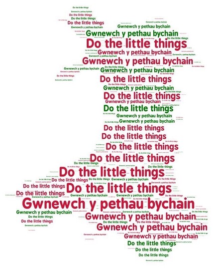 A map of Cymru made up of the words ‘Gwnewch y pethau bychain’ and ‘Do the little things’ in various font sizes and in red and green 