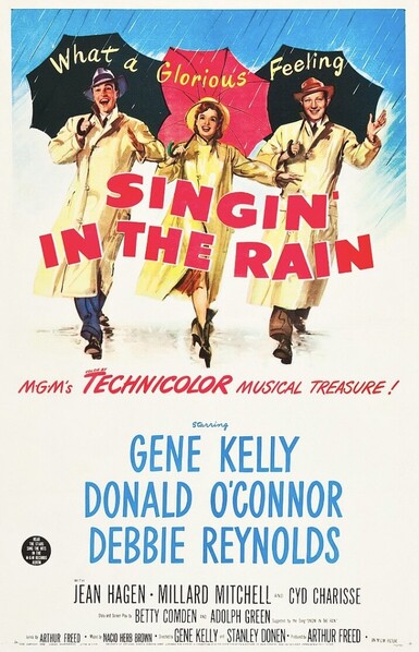 Three people dancing with umbrellas 