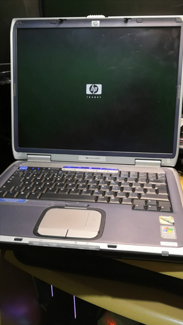 HP Pavilion ze4800 laptop, power lights on, starting to power up. The HP logo can be seen on the LCD display.