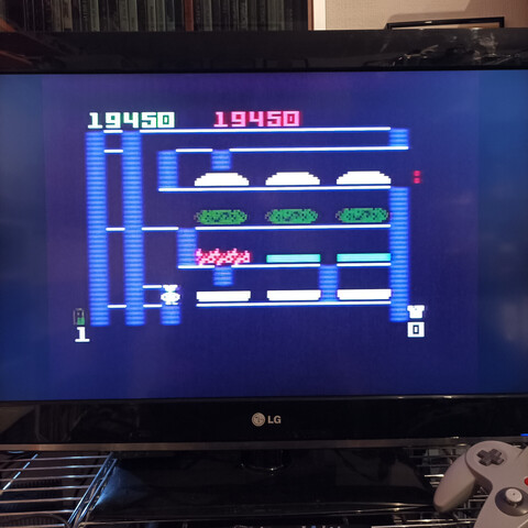 Gameplay image: "Burger Time" on Intellivision. Platform game where a chef assembles burgers... by running over the ingredients?!