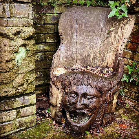 Scary wooden chair with a face 