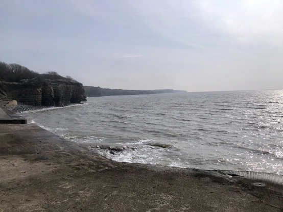 Views across the hazy sea from St Donats