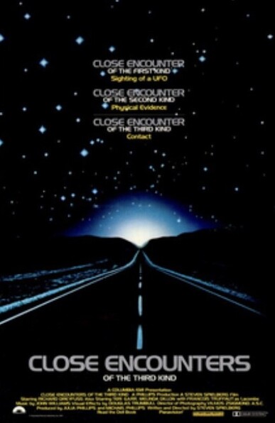 A road leading to a light on the horizon 