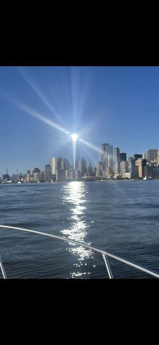Freedom Tower reflecting the setting sun
