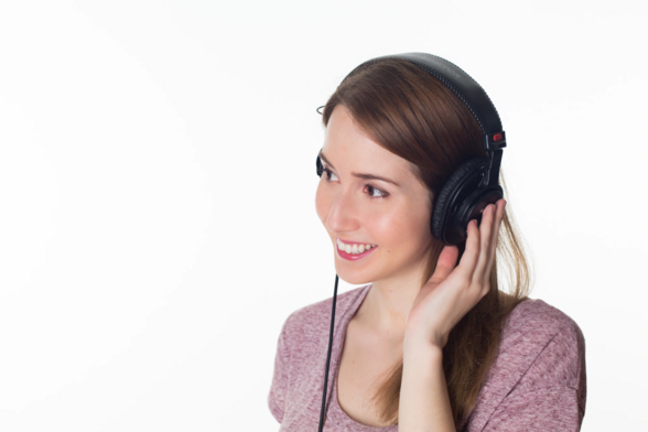 A young woman listening to an audiobook 