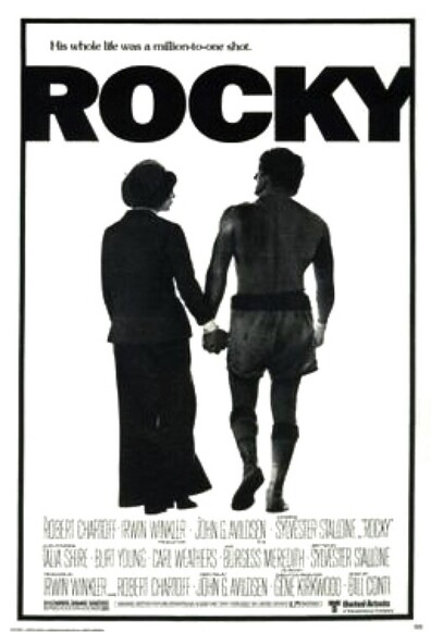 A woman holding hands with a boxer 