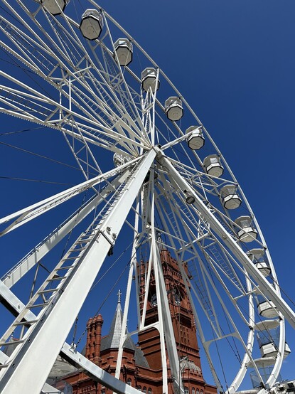 Close up of the big wheel against deep blue sky