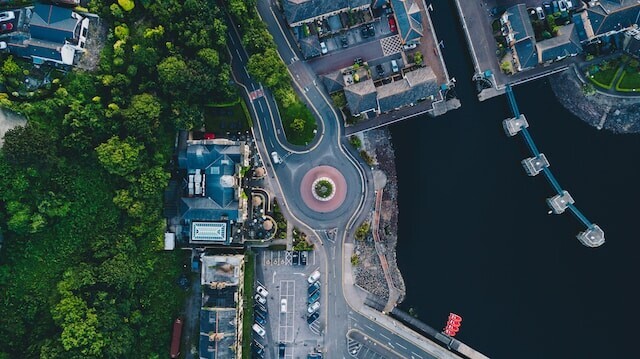 Aerial view of an urban area showing water, trees and buildings