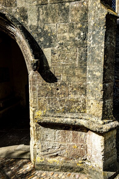 St Thomas' Church at Redwick:

The stone wall next to the Porch of the church showing the level to which the water reached during the "Great Flood" of 1606. A Circle with a line through it marks the level, whilst below is inscribed "GREAT FLOOD, A.D. 1606". The mark is just below where the arch starts on the Porch Entrance, approximately 1.3M  high