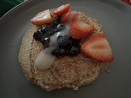 Oat and banana pancake with fruit on top 