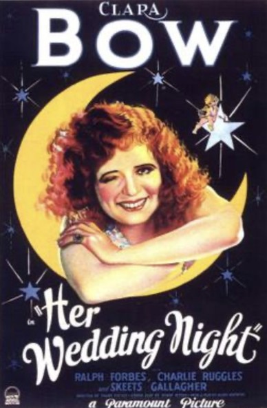 Red-headed woman looking through a crescent moon 