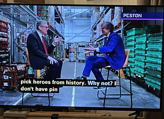 Photo of television with Robert Peston wearing a very blue suit