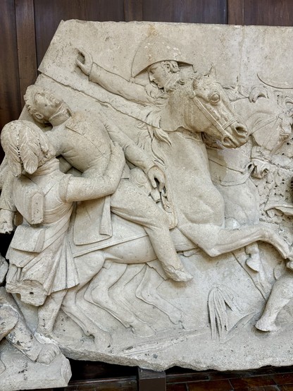 Stone carving of Captain Picton falling from his horse in battle at Waterloo. 