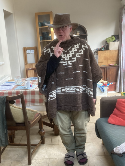 Man. In poncho 