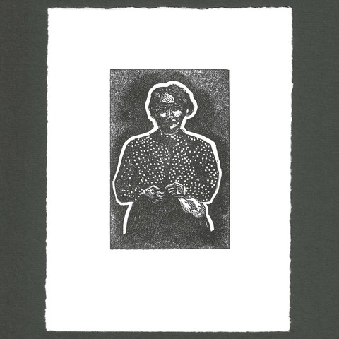Linocut print of an elderly woman wearing a polka dot blouse.  The woman is haloed with a white border beyond is a black shadow fading to grey.