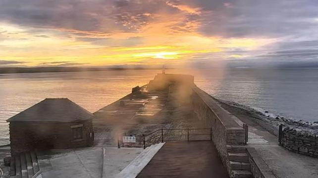 Sunrise behind the Porthcawl lighthouse