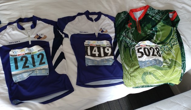 A set of 3 orienteering tops with number bibs on