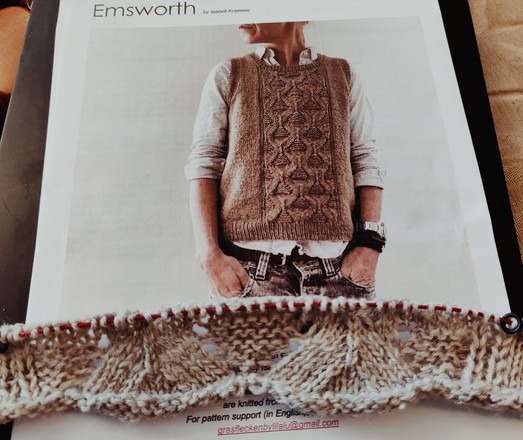 Photo of knitting pattern emsworth by Isabel Kramer. Knitted vest . At the bottom my swatch in a natural coloured wool