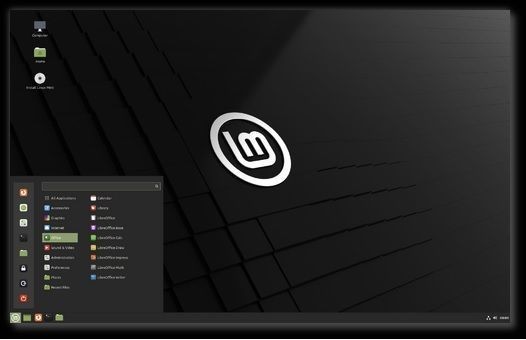 Llun o fwrdd gwaith a dewislen Linux Mint, y system weithredu poblogaidd. Mae rhyngwyneb y rhaglen ar gale yn Gymraeg a nifer o raglenni linux eraill hefyd - LibreOffice, Firefox ac ati.