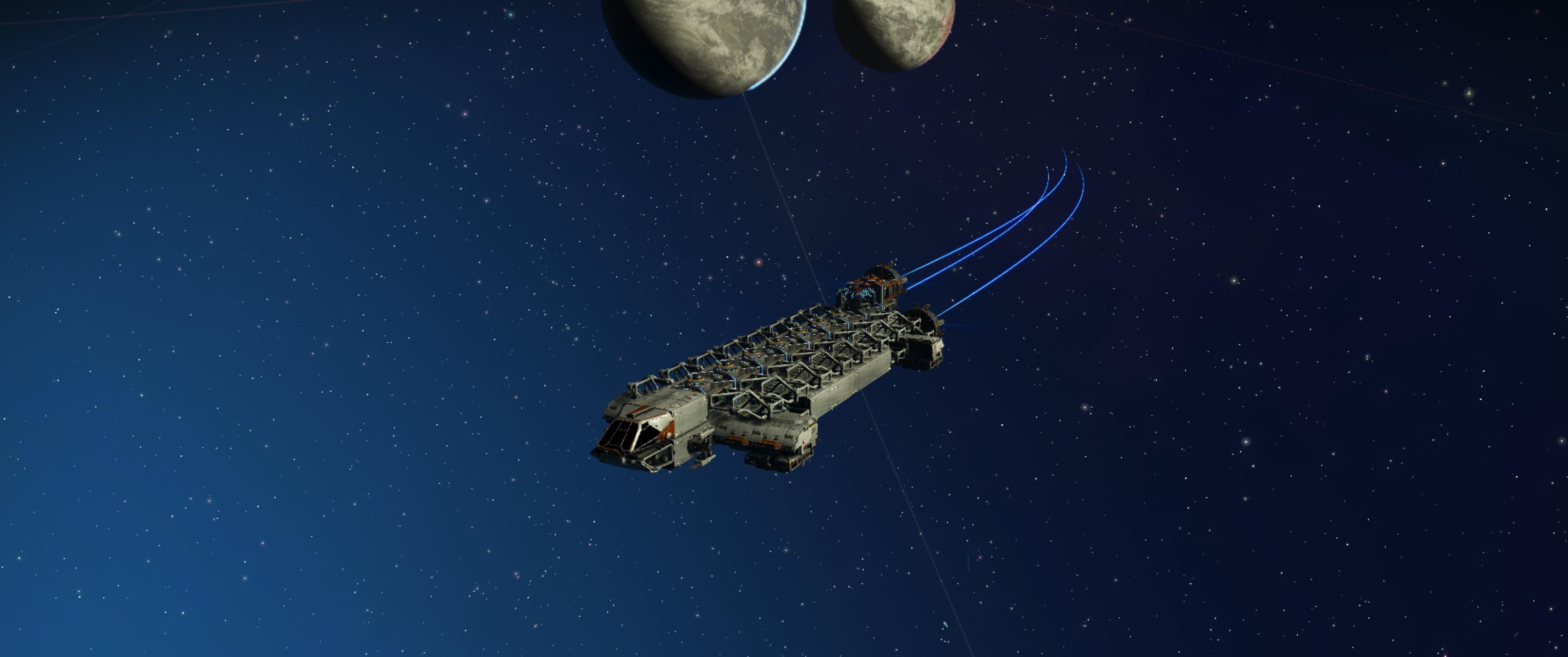 A long, modular, industrial spacecraft in space, two moons behind. 